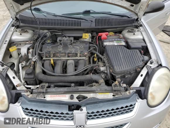 2004 Dodge Neon SXT with VIN 1B3ES56C54D628554, listed as a Copart auction lot 73219764 with 67,373 mi miles and Salvage title. Bid and sale history available at DreamBid. Image 12.