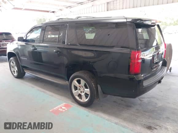 2015 Chevrolet Suburban LT z VIN 1GNSKJKC7FR199544, wystawiony jako IAAI lot #42169017 z przebiegiem 219 219 mil mil oraz . Historia ofert i sprzedaży dostępna na DreamBid. Obrazek 3.