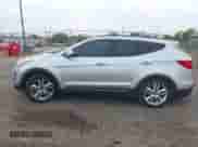 2015 Hyundai Santa Fe z VIN 5XYZW4LAXFG294009, wystawiony jako IAAI lot #43493851 z przebiegiem 89 481 mil mil oraz . Historia ofert i sprzedaży dostępna na DreamBid. Obrazek 14.