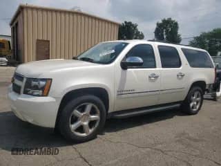 2014 Chevrolet Suburban LTZ with VIN 1GNSKKE75ER128006, listed as a Copart auction lot 64720805 with 190,686 mi miles and Salvage title. Bid and sale history available at DreamBid. Image 1.