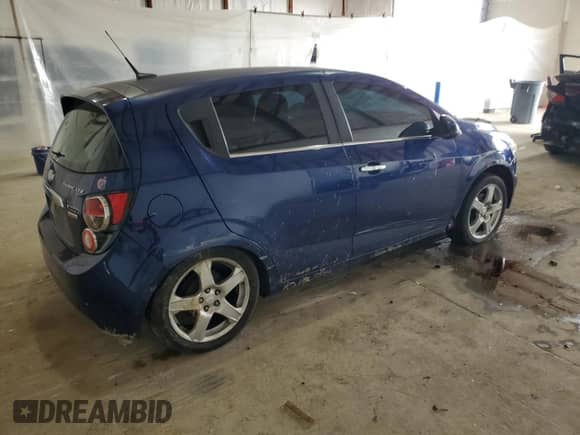 2013 Chevrolet Sonic LTZ с VIN 1G1JE6SB8D4223594, выставлен на аукционе Copart как лот 55657765 с пробегом 180 407 миль миль и Списание • Salvage title. История ставок и продаж доступна на DreamBid. Изображение 3.