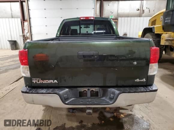 2011 Toyota Tundra с VIN 5TFUY5F14BX174154, выставлен на аукционе Copart как лот 84732355 с пробегом 97 053 миль миль и Списание • Salvage title. История ставок и продаж доступна на DreamBid. Изображение 6.