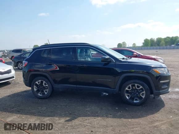 2021 Jeep Compass Altitude with VIN 3C4NJCBB0MT502423, listed as a IAAI auction lot 42006742 with 63,418 mi miles and . Bid and sale history available at DreamBid. Image 13.