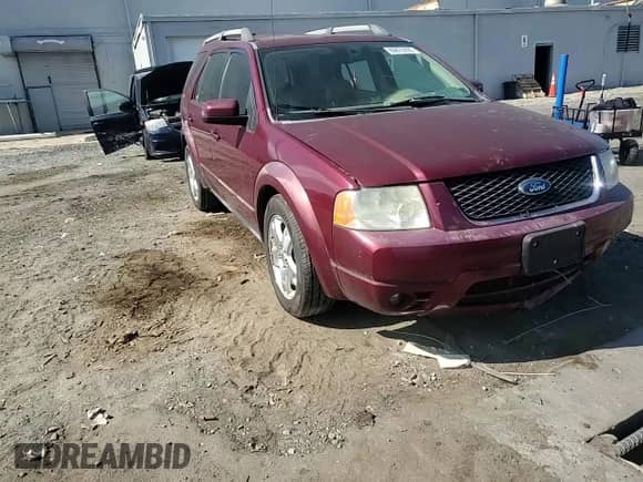 2006 Ford Freestyle Limited with VIN 1FMDK06136GA08228, listed as a Copart auction lot 69879995 with 214,776 mi miles and Salvage title. Bid and sale history available at DreamBid. Image 14.