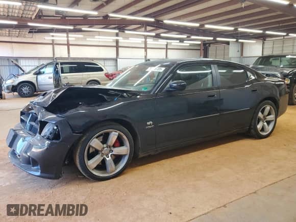 2007 Dodge Charger SRT-8 with VIN 2B3KA73W67H652417, listed as a Copart auction lot 70518705 with 75,440 mi miles and Salvage title. Bid and sale history available at DreamBid. Image 1.