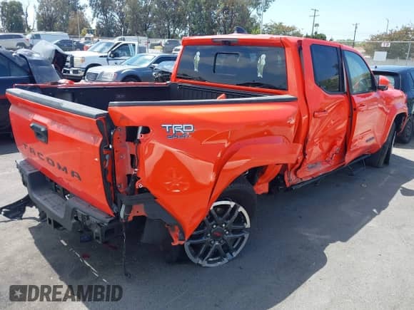 2024 Toyota Tacoma SR5 with VIN 3TYKB5FN7RT014768, listed as a IAAI auction lot 43051750 with 18,990 mi miles and . Bid and sale history available at DreamBid. Image 4.