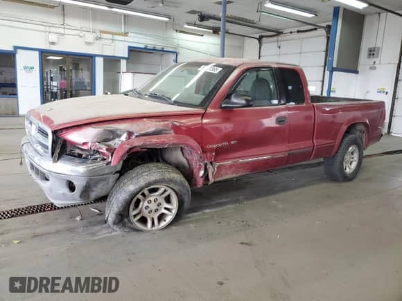 1998 Dodge Dakota SLT with VIN 1B7GG22Y6WS601113, listed as a Copart auction lot 56521565 with 266,465 mi miles and Salvage title. Bid and sale history available at DreamBid. Image 1.