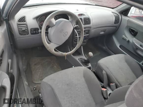 2005 Hyundai Accent GLS z VIN KMHCG35C55U341192, wystawiony jako Copart lot #70708994 z przebiegiem 174 872 mil mil oraz Szkoda całkowita • Salvage title. Historia ofert i sprzedaży dostępna na DreamBid. Obrazek 8.