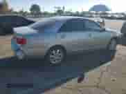 2005 Toyota Camry LE с VIN JTDBF30KX50160730, выставлен на аукционе Copart как лот 84997435 с пробегом 238 964 миль миль и Списание • Salvage title. История ставок и продаж доступна на DreamBid. Изображение 3.