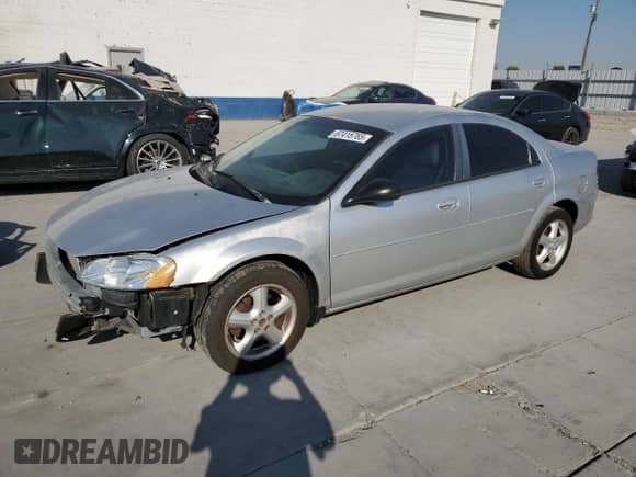 2005 Dodge Stratus SXT with VIN 1B3EL46R25N669389, listed as a Copart auction lot 67415765 with 167,939 mi miles and Salvage title. Bid and sale history available at DreamBid. Image 1.