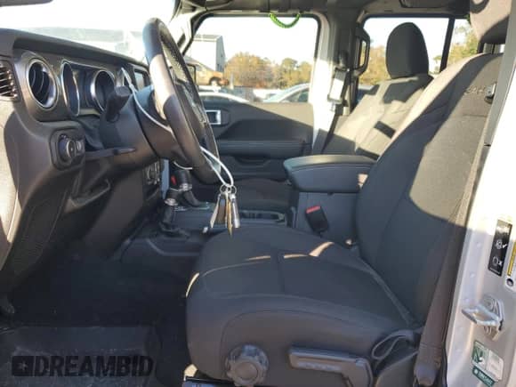 2023 Jeep Wrangler Sahara Altitude with VIN 1C4HJXEG1PW601584, listed as a Copart auction lot 84018874 with 12,003 mi miles and Salvage title. Bid and sale history available at DreamBid. Image 7.