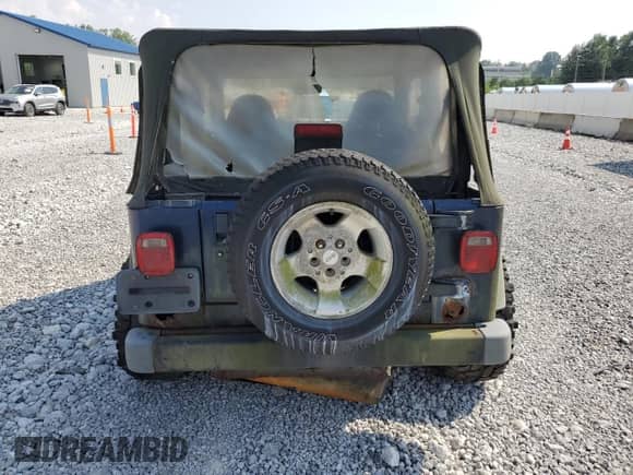 2000 Jeep Wrangler Sport with VIN 1J4FA49S5YP744967, listed as a Copart auction lot 67909665 with 141,990 mi miles and Clean title. Bid and sale history available at DreamBid. Image 6.