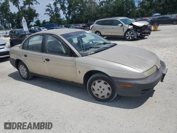 1997 Saturn SL z VIN 1G8ZF5288VZ115030, wystawiony jako Copart lot #80317135 z przebiegiem 259 292 mil mil oraz Szkoda całkowita • Salvage title. Historia ofert i sprzedaży dostępna na DreamBid. Obrazek 4.