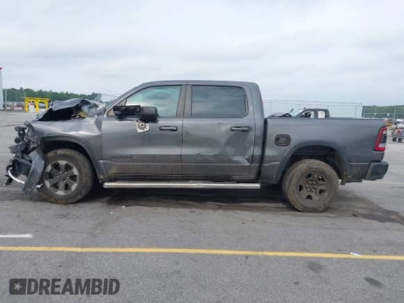 2019 Ram 1500 Rebel z VIN 1C6RRELT5KN625118, wystawiony jako IAAI lot #42426818 z przebiegiem 116 429 mil mil oraz . Historia ofert i sprzedaży dostępna na DreamBid. Obrazek 14.