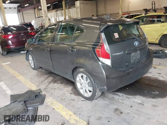 2015 Toyota Prius One z VIN JTDKDTB3XF1106075, wystawiony jako IAAI lot #41851234 z przebiegiem 80 517 mil mil oraz . Historia ofert i sprzedaży dostępna na DreamBid. Obrazek 3.