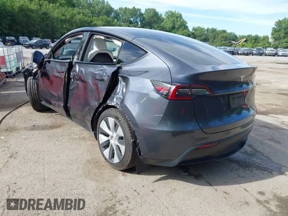 2023 Tesla Model Y Long Range z VIN 7SAYGAEE8PF880355, wystawiony jako IAAI lot #42635761 z przebiegiem 57 442 mil mil oraz . Historia ofert i sprzedaży dostępna na DreamBid. Obrazek 3.