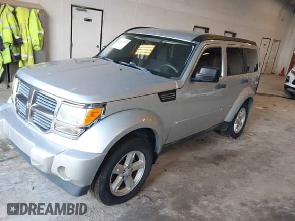 2007 Dodge Nitro SXT with VIN 1D8GU28K17W731307, listed as a IAAI auction lot 43160059 with 168,275 mi miles and . Bid and sale history available at DreamBid. Image 2.