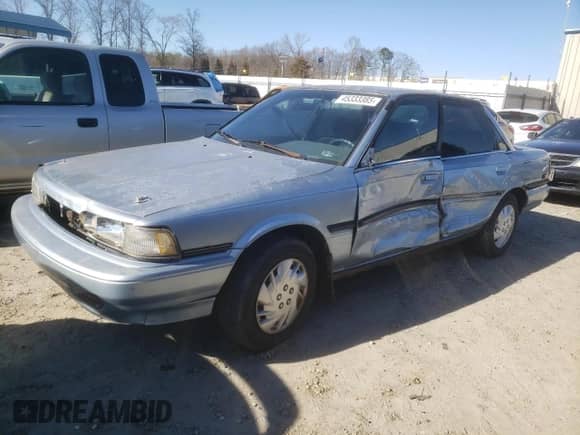 1991 Toyota Camry DLX с VIN 4T1SV21E2MU451022, выставлен на аукционе Copart как лот 45333385 с пробегом 229 058 миль миль и Списание • Salvage title. История ставок и продаж доступна на DreamBid. Изображение 1.