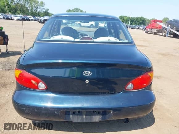 2000 Hyundai Elantra GLS z VIN KMHJF35F4YU967843, wystawiony jako IAAI lot #42817274 z przebiegiem 85 044 mil mil oraz . Historia ofert i sprzedaży dostępna na DreamBid. Obrazek 16.