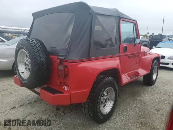 1991 Jeep Wrangler with VIN 2J4FY69S5MJ129348, listed as a Copart auction lot 74758154 with Not provided miles and Salvage title. Bid and sale history available at DreamBid. Image 3.