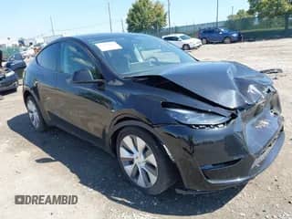 2023 Tesla Model Y Long Range z VIN 7SAYGDEE0PA201841, wystawiony jako IAAI lot #43158634 z przebiegiem 10 356 mil mil oraz . Historia ofert i sprzedaży dostępna na DreamBid. Obrazek 1.