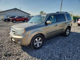 2011 Honda Pilot EX-L z VIN 5FNYF4H52BB021557, wystawiony jako Copart lot #84754845 z przebiegiem Nie podano mil oraz Czysty tytuł • Clean title. Historia ofert i sprzedaży dostępna na DreamBid. Obrazek 1.