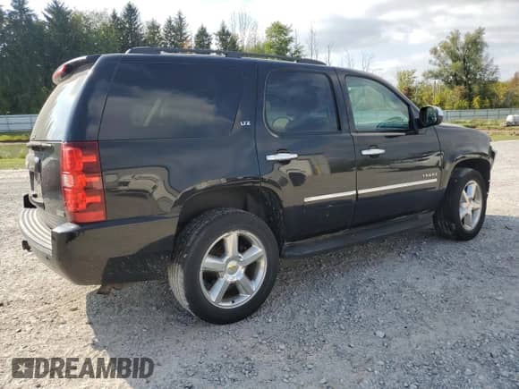 2011 Chevrolet Tahoe LTZ z VIN 1GNSKCE09BR177990, wystawiony jako Copart lot #81012815 z przebiegiem 194 704 mil mil oraz Szkoda całkowita • Salvage title. Historia ofert i sprzedaży dostępna na DreamBid. Obrazek 3.