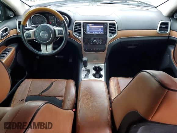 2012 Jeep Grand Cherokee Overland with VIN 1C4RJECG5CC251450, listed as a Copart auction lot 70744305 with 122,000 mi miles and Salvage title. Bid and sale history available at DreamBid. Image 8.