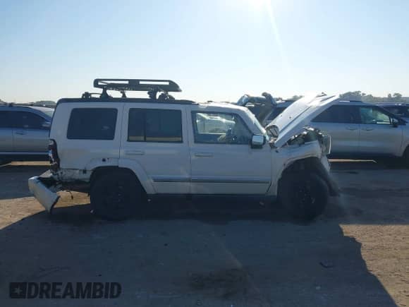 2010 Jeep Commander Sport with VIN 1J4RG4GK3AC127823, listed as a IAAI auction lot 43193107 with 149,771 mi miles and . Bid and sale history available at DreamBid. Image 13.