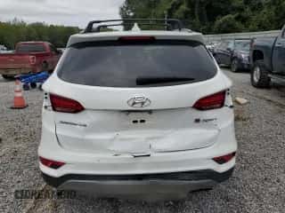 2017 Hyundai Santa Fe 2.4L z VIN 5XYZU3LBXHG460069, wystawiony jako Copart lot #83951535 z przebiegiem 85 558 mil mil oraz Szkoda całkowita • Salvage title. Historia ofert i sprzedaży dostępna na DreamBid. Obrazek 6.
