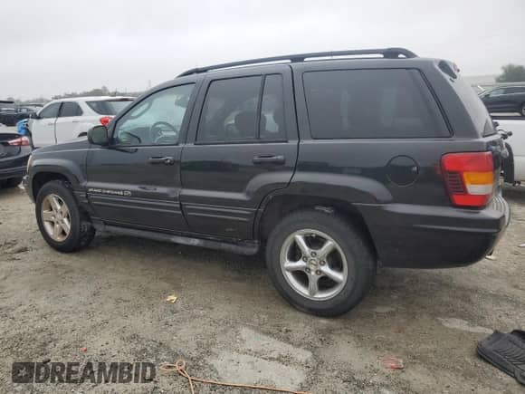 2002 Jeep Grand Cherokee Overland with VIN 1J8GW68JX2C290531, listed as a Copart auction lot 90013135 with 169,552 mi miles and Salvage title. Bid and sale history available at DreamBid. Image 2.