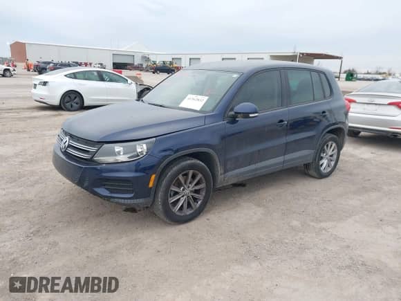 2014 Volkswagen Tiguan S с VIN WVGAV3AX0EW561155, выставлен на аукционе IAAI как лот 41362832 с пробегом 65 399 миль миль и . История ставок и продаж доступна на DreamBid. Изображение 17.