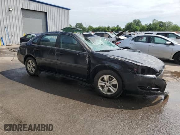 2015 Chevrolet Impala LS with VIN 2G1WA5E38F1145106, listed as a Copart auction lot 61351435 with 145,965 mi miles and Salvage title. Bid and sale history available at DreamBid. Image 4.