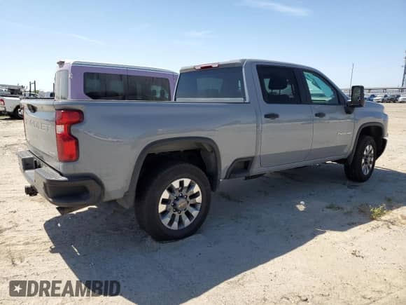 2025 Chevrolet Silverado 2500 with VIN 2GC4KME7XS1122705, listed as a Copart auction lot 56422895 with 7,276 mi miles and Salvage title. Bid and sale history available at DreamBid. Image 3.