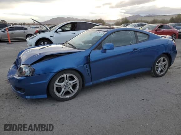 2005 Hyundai Tiburon GT с VIN KMHHN65F45U183144, выставлен на аукционе Copart как лот 87487994 с пробегом 59 582 миль миль и Списание • Salvage title. История ставок и продаж доступна на DreamBid. Изображение 1.