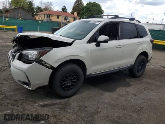 2017 Subaru Forester Touring z VIN JF2SJGTC9HH412677, wystawiony jako Copart lot #68206405 z przebiegiem 130 892 mil mil oraz Szkoda całkowita • Salvage title. Historia ofert i sprzedaży dostępna na DreamBid. Obrazek 1.
