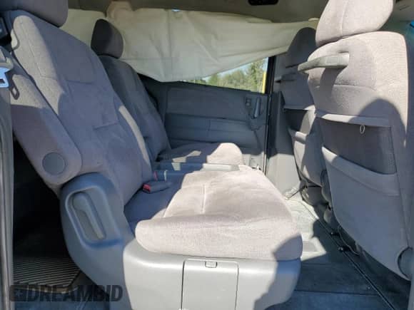 2006 Honda Odyssey EX z VIN 5FNRL384X6B108109, wystawiony jako Copart lot #71307835 z przebiegiem 172 458 mil mil oraz Szkoda całkowita • Salvage title. Historia ofert i sprzedaży dostępna na DreamBid. Obrazek 11.