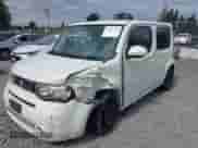 2010 Nissan Cube SL z VIN JN8AZ2KR2AT165747, wystawiony jako IAAI lot #43163185 z przebiegiem 134 161 mil mil oraz . Historia ofert i sprzedaży dostępna na DreamBid. Obrazek 6.