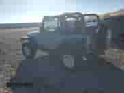 1999 Jeep Wrangler Sport with VIN 1J4FY19S1XP455674, listed as a Copart auction lot 86821605 with 218,356 mi miles and Clean title. Bid and sale history available at DreamBid. Image 2.