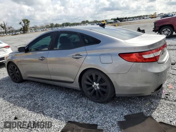 2013 Hyundai Azera z VIN KMHFH4JG1DA230468, wystawiony jako Copart lot #68003885 z przebiegiem 147 684 mil mil oraz Szkoda całkowita • Salvage title. Historia ofert i sprzedaży dostępna na DreamBid. Obrazek 2.