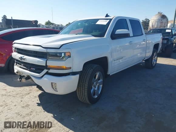 2018 Chevrolet Silverado 1500 LT with VIN 1GCUKRECXJF180945, listed as a IAAI auction lot 42450588 with 108,199 mi miles and . Bid and sale history available at DreamBid. Image 2.