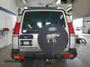 2000 Land Rover Discovery Cloth with VIN SALTY1541YA261319, listed as a Copart auction lot 86040445 with 153,917 mi miles and Clean title. Bid and sale history available at DreamBid. Image 6.