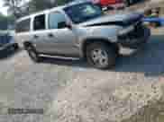 2005 Chevrolet Suburban LS with VIN 3GNEC16Z95G159375, listed as a Copart auction lot 65865884 with 290,671 mi miles and Salvage title. Bid and sale history available at DreamBid. Image 4.