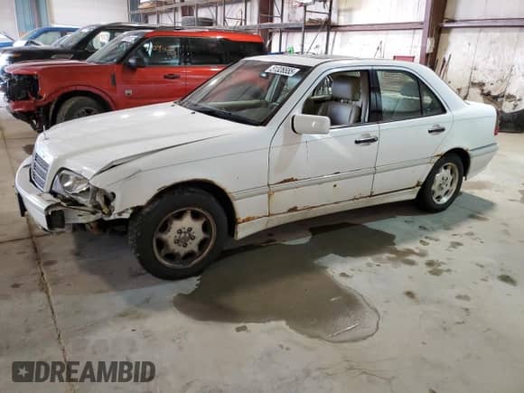 1999 Mercedes-Benz C 230/260/280/320 z VIN WDBHA24G5XA716110, wystawiony jako Copart lot #51326555 z przebiegiem 107 190 mil mil oraz Szkoda całkowita • Salvage title. Historia ofert i sprzedaży dostępna na DreamBid. Obrazek 1.
