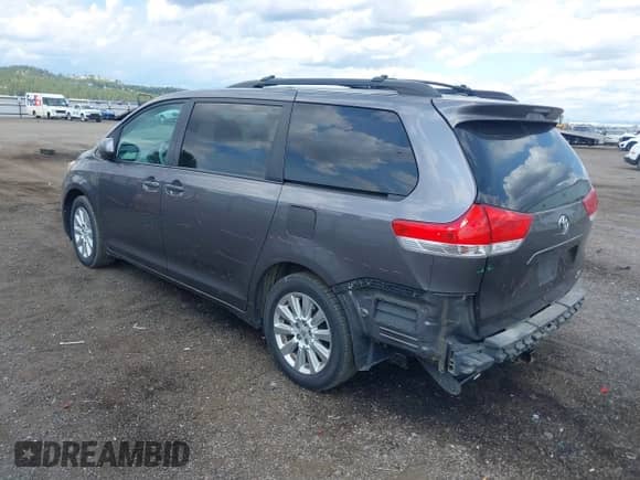 2012 Toyota Sienna LE with VIN 5TDJK3DC3CS037713, listed as a IAAI auction lot 42703815 with 208,000 mi miles and . Bid and sale history available at DreamBid. Image 3.