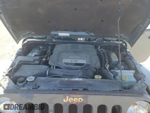 2015 Jeep Wrangler Rubicon Hard Rock z VIN 1C4BJWCG2FL659660, wystawiony jako Copart lot #55801305 z przebiegiem 71 919 mil mil oraz Szkoda całkowita • Salvage title. Historia ofert i sprzedaży dostępna na DreamBid. Obrazek 11.