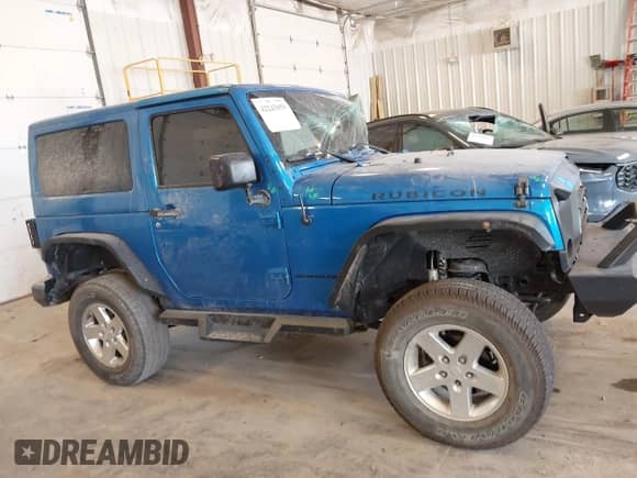 2015 Jeep Wrangler Rubicon Hard Rock z VIN 1C4BJWCG3FL568848, wystawiony jako IAAI lot #42243059 z przebiegiem 60 860 mil mil oraz . Historia ofert i sprzedaży dostępna na DreamBid. Obrazek 13.