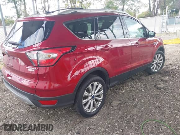 2017 Ford Escape Titanium with VIN 1FMCU9JD9HUE63259, listed as a IAAI auction lot 43370536 with 105,632 mi miles and . Bid and sale history available at DreamBid. Image 4.