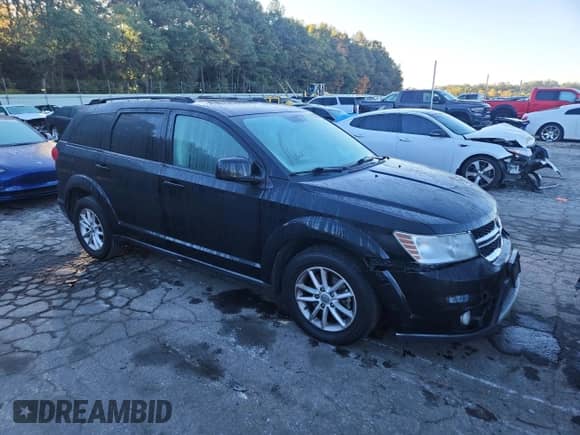 2014 Dodge Journey SXT with VIN 3C4PDCBG3ET224260, listed as a Copart auction lot 87388355 with 200,497 mi miles and Salvage title. Bid and sale history available at DreamBid. Image 4.