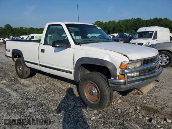 1999 Chevrolet Silverado 2500 с VIN 1GCGK24R1XR706557, выставлен на аукционе Copart как лот 59530245 с пробегом 81 028 миль миль и Списание • Salvage title. История ставок и продаж доступна на DreamBid. Изображение 4.